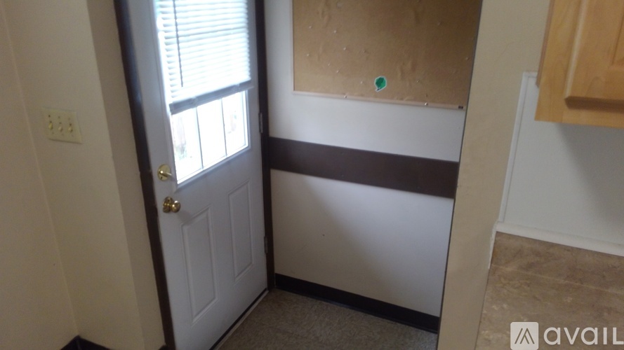 A room with a door and a window.