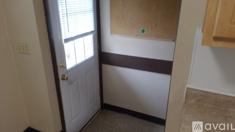 A room with a door and a window.