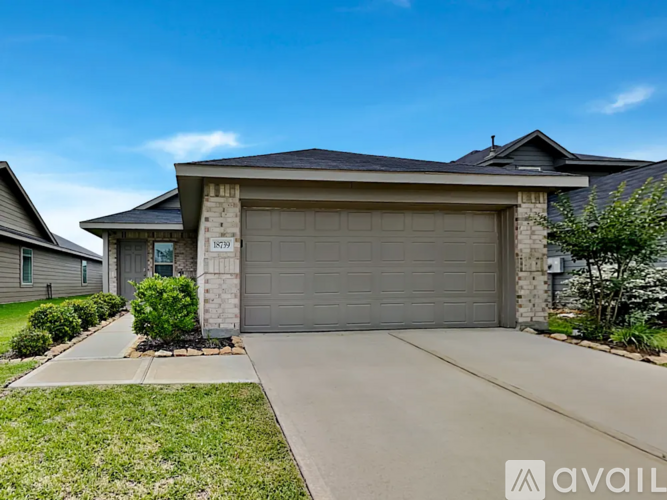 A house with a garage is for sale.