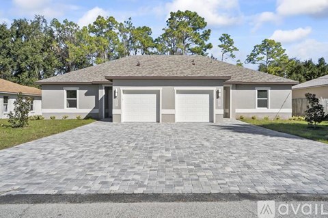 A house with a driveway in front of it.
