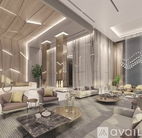 A modern living room with a marble coffee table and a large chandelier.