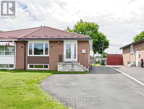 A house with a red roof and a sign that says EXP REALTY Brokerage.