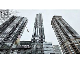 A tall building with the words "Now On Smart" on the side.