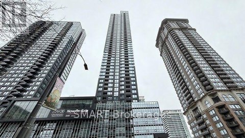 A tall building with the words "Now On Smart" on the side.