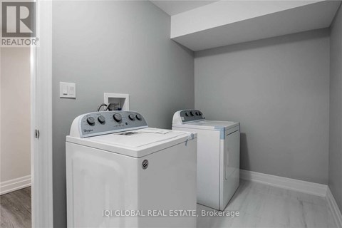 A white washer and dryer in a laundry room.