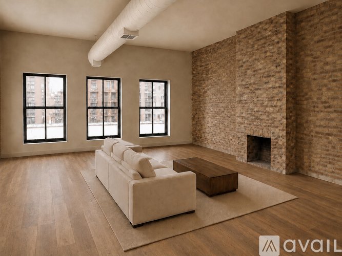 A living room with a brick wall and a fireplace.