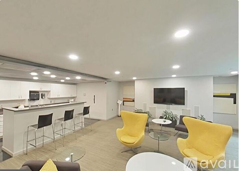 A modern living room with a bar area and a television.