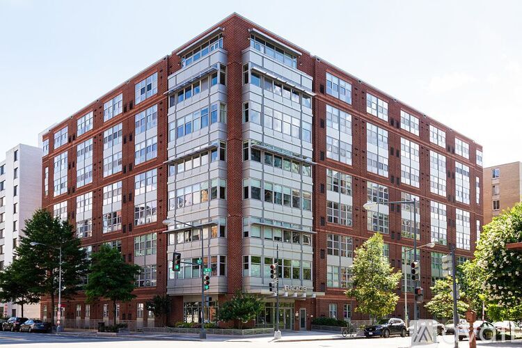 A large red brick building with many windows.