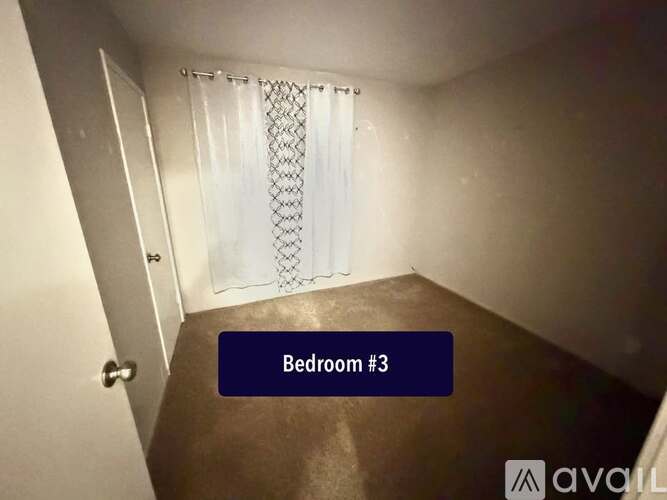 Bedroom #3 is shown with a white curtain and a wooden floor.