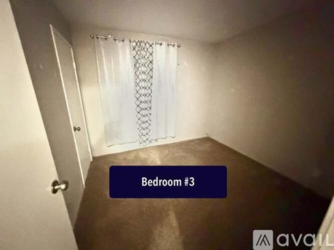 Bedroom #3 is shown with a white curtain and a wooden floor.
