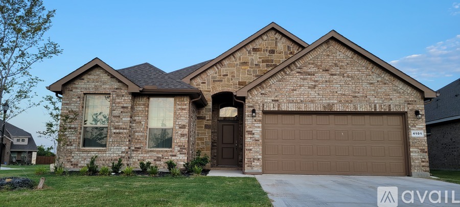 A house with a brown garage door is for sale.