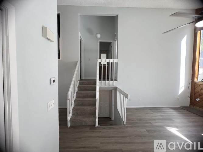 A room with a staircase and a window.