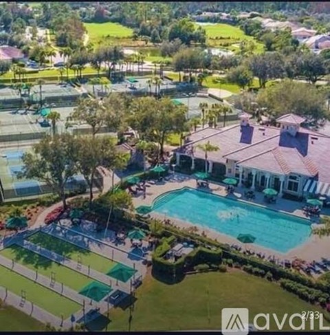 A large house with a pool in the backyard.