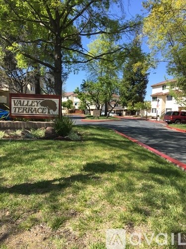 A sign that says Valley Terrace in front of a building.