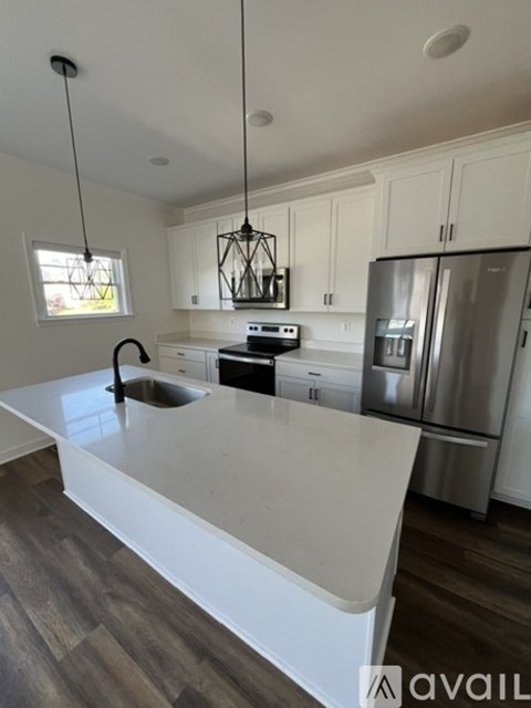 A modern kitchen with a large island in the middle.