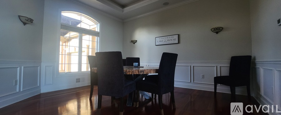 A dining room with a table set for four.