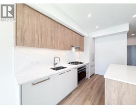 A modern kitchen with white countertops and wooden cabinets.