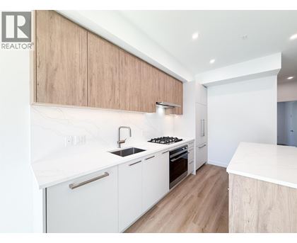 A modern kitchen with white countertops and wooden cabinets.