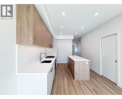 A modern kitchen with wooden cabinets and a white countertop.