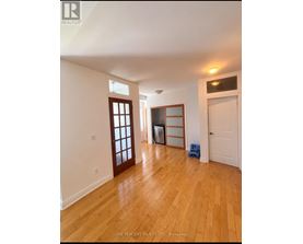 A room with wooden floors and white walls.