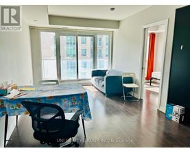 A room with a table and chairs in it.