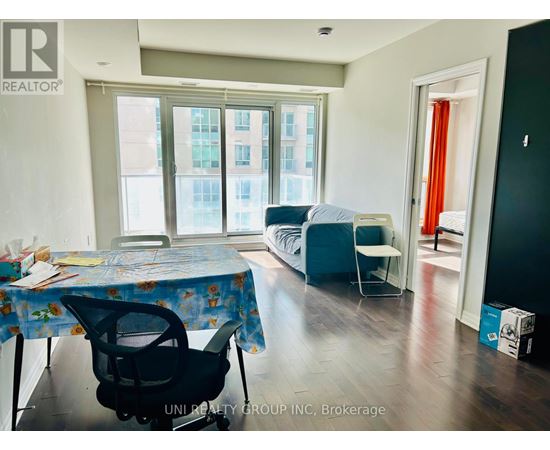 A room with a table and chairs in it.