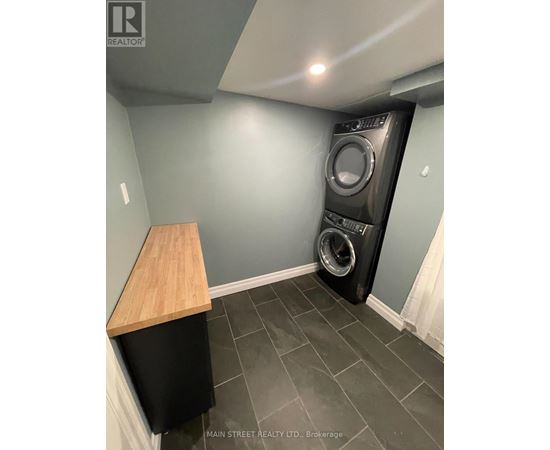 A laundry room with a washer and dryer.