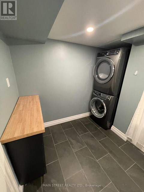 A laundry room with a washer and dryer.