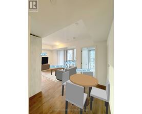 A living room with a TV, sofa, and dining table.