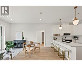A modern kitchen with a dining table and chairs.