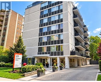 A tall apartment building with the number 177 on a sign in front of it.
