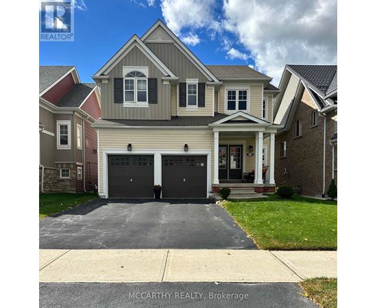 A two-story house with a garage is for sale by McCarthy Realty in Brokerage.