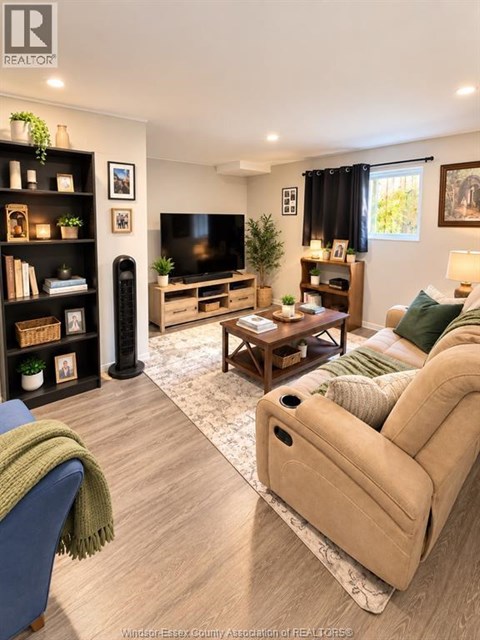 A living room with a blue couch and a beige sofa.