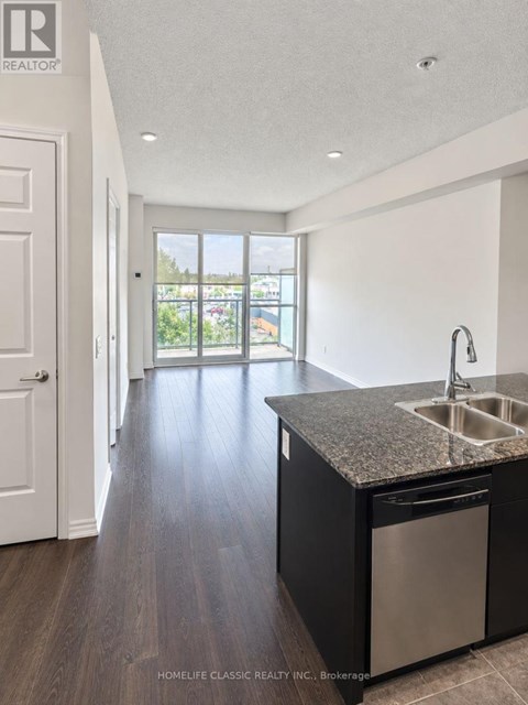 A kitchen with a sink and a dishwasher.