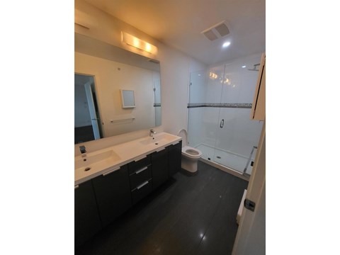 A bathroom with a sink, toilet, and bathtub.