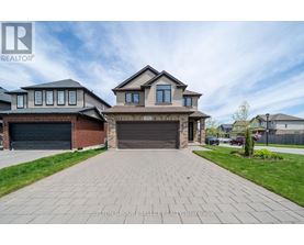 A house with a driveway in front of it is for sale.