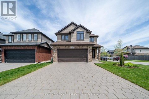 A house with a driveway in front of it is for sale.