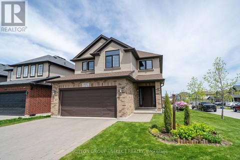 A house with a brown garage door is for sale.