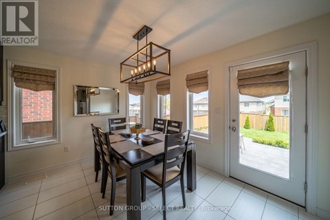 A dining room with a table set for six.