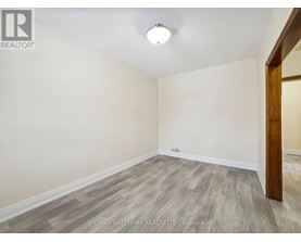 A room with a wooden floor and a white ceiling.