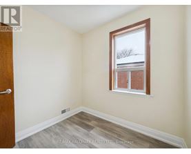 A room with a window and a door.