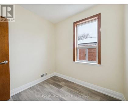 A room with a window and a door.