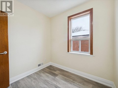 A room with a window and a door.