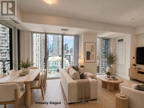 A living room with a view of the city skyline.
