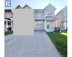 A house with a driveway in front of it and a sign that says "REALTOR".