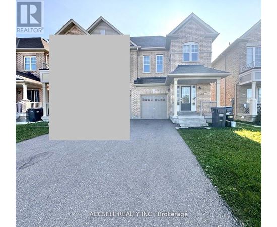 A house with a driveway in front of it and a sign that says "REALTOR".