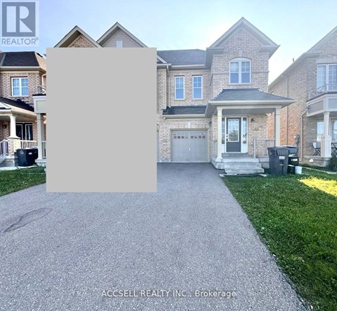 A house with a driveway in front of it and a sign that says "REALTOR".
