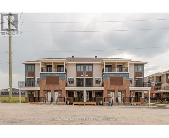A large apartment complex with multiple balconies and doors.