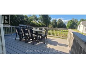 A deck with a table and chairs is shown.