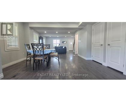 A dining room with a table and chairs is shown in the image.
